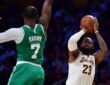 LeBron James of the Lakers shoots a jump shot over Jaylen Brown of the Celtics during a game at Crypto.com Arena