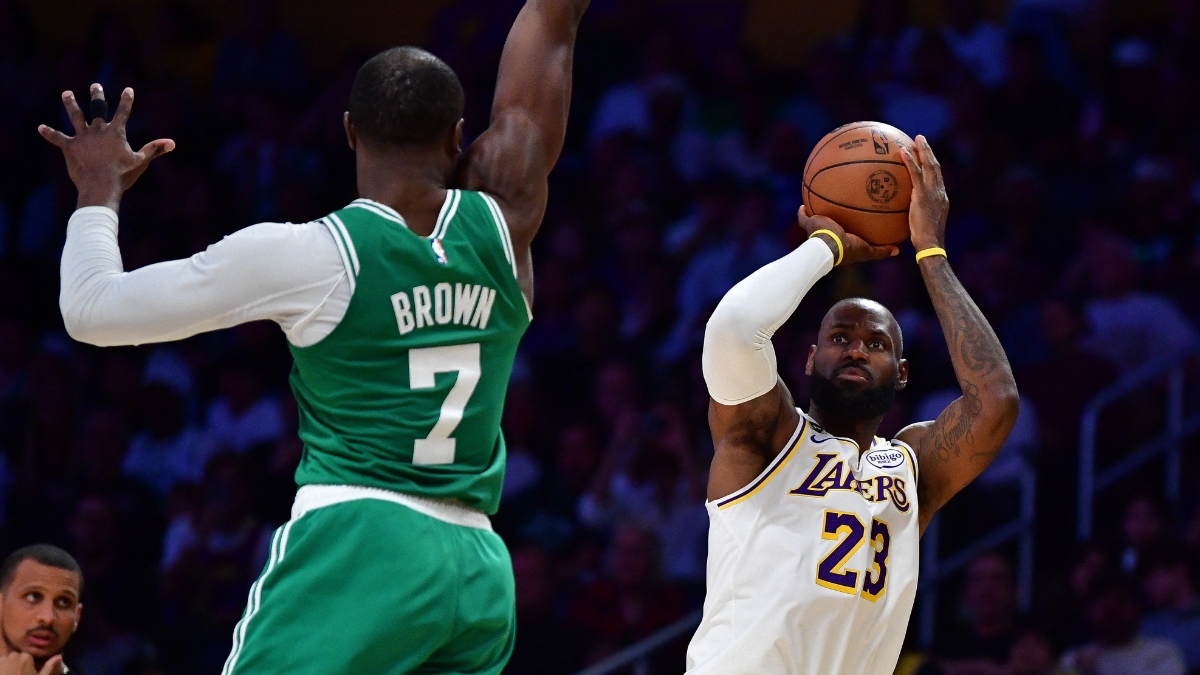 LeBron James of the Lakers shoots a jump shot over Jaylen Brown of the Celtics during a game at Crypto.com Arena