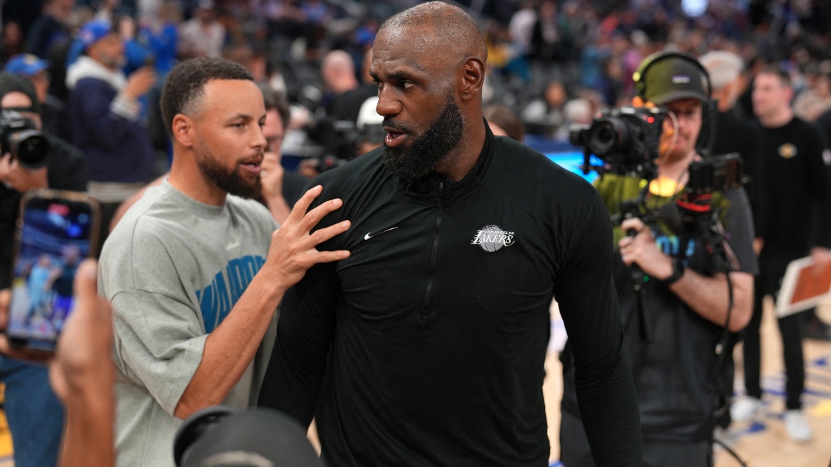 Los Angeles Lakers forward LeBron James #23 meets with Golden State Warriors guard Stephen Curry #30 after a game at Chase Center.