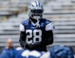 Dallas Cowboys safety Malik Hooker in a navy No. 28 practice jersey and helmet during a team practice