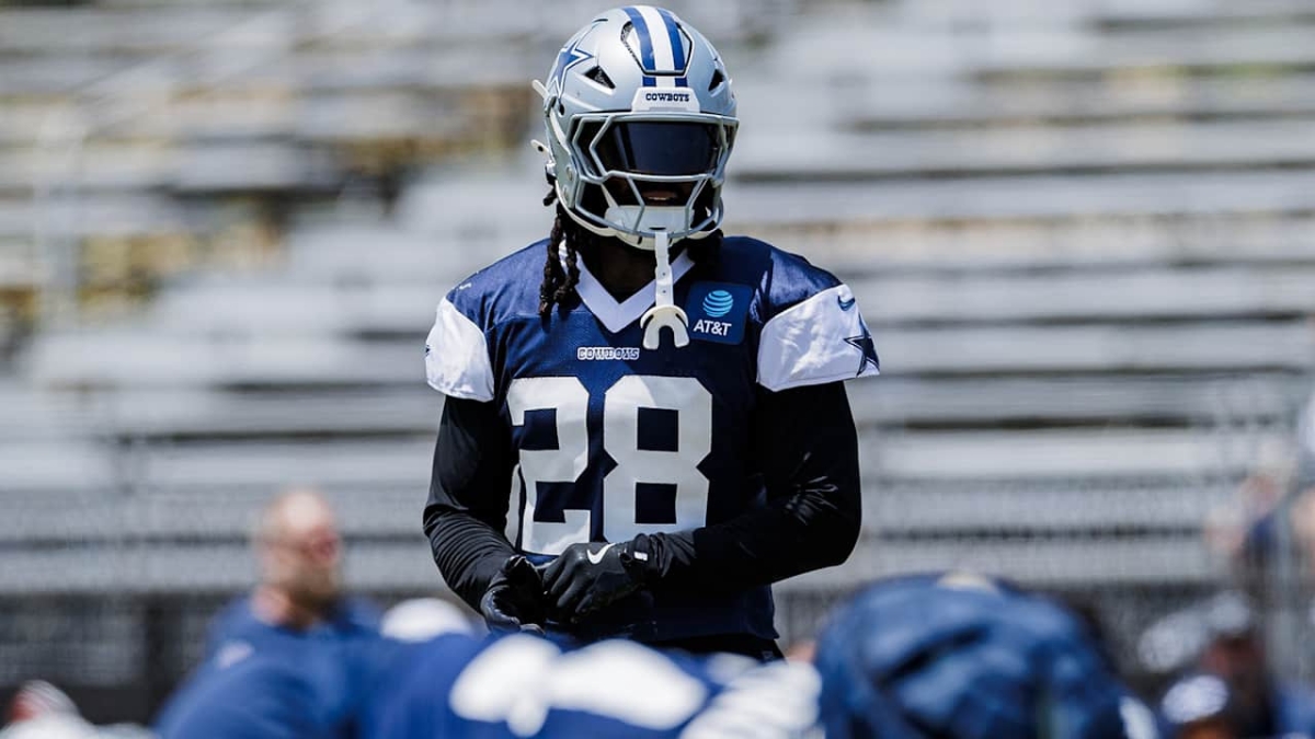 Dallas Cowboys safety Malik Hooker in a navy No. 28 practice jersey and helmet during a team practice