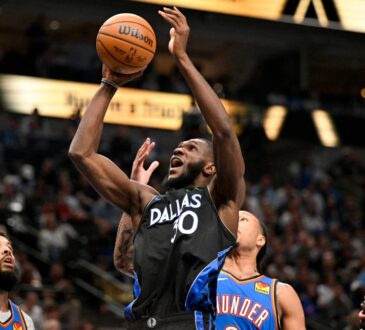 Dallas Mavericks center Moussa Cissé grabs a rebound over Oklahoma City Thunder forward Jaylin Williams at American Airlines Center