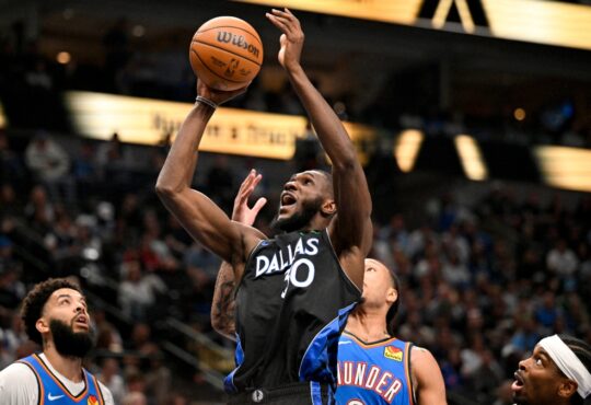 Dallas Mavericks center Moussa Cissé grabs a rebound over Oklahoma City Thunder forward Jaylin Williams at American Airlines Center