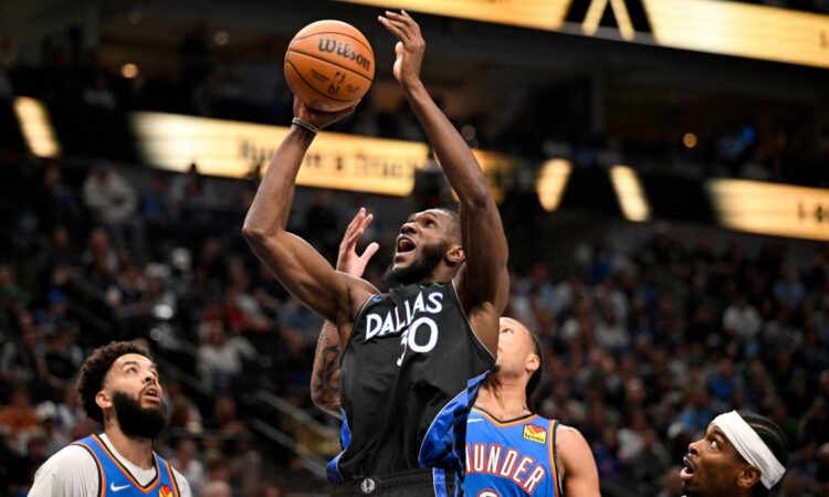 Dallas Mavericks center Moussa Cissé grabs a rebound over Oklahoma City Thunder forward Jaylin Williams at American Airlines Center