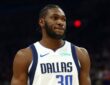 Dallas Mavericks center Moussa Cissé in a white No. 30 jersey against the Phoenix Suns