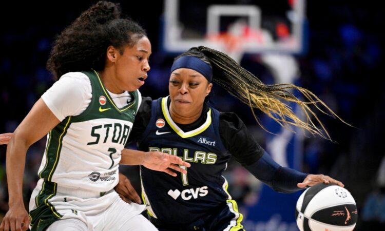 Odyssey Sims of the Dallas Wings drives past Zia Cooke of the Seattle Storm during their WNBA game on June 1, 2026