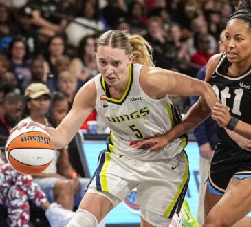 Dallas Wings guard Paige Bueckers drives past Atlanta Dream guard Indya Nivar at Gateway Center Arena in College Park