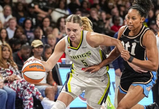 Dallas Wings guard Paige Bueckers drives past Atlanta Dream guard Indya Nivar at Gateway Center Arena in College Park
