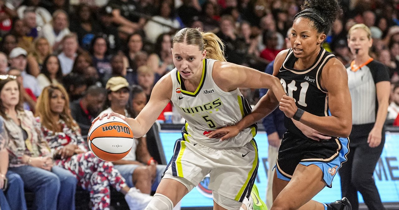 Dallas Wings guard Paige Bueckers drives past Atlanta Dream guard Indya Nivar at Gateway Center Arena in College Park