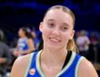 Dallas Wings guard Paige Bueckers smiles on the court at College Park Center after a game against the Las Vegas Aces.
