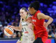 Dallas Wings guard Paige Bueckers drives to the basket as Atlanta Dream guard Allisha Gray defends.