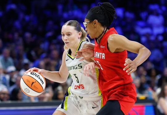 Dallas Wings guard Paige Bueckers drives to the basket as Atlanta Dream guard Allisha Gray defends.