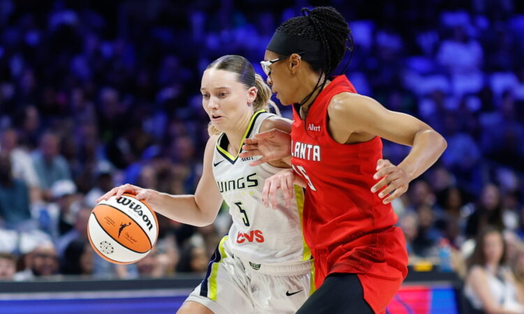 Dallas Wings guard Paige Bueckers drives to the basket as Atlanta Dream guard Allisha Gray defends.