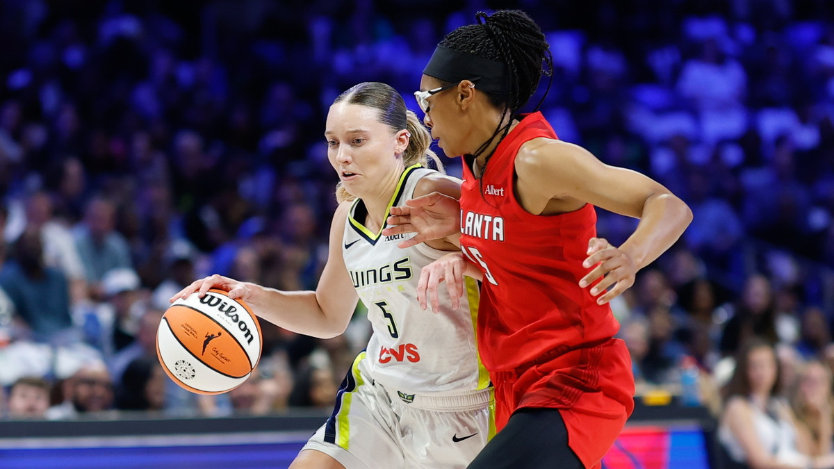 Dallas Wings guard Paige Bueckers drives to the basket as Atlanta Dream guard Allisha Gray defends.