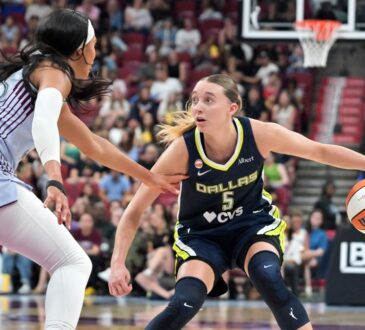 Dallas Wings guard Paige Bueckers drives with the ball as Toronto Tempo forward Isabelle Harrison defends during the first half at Bell Centre.