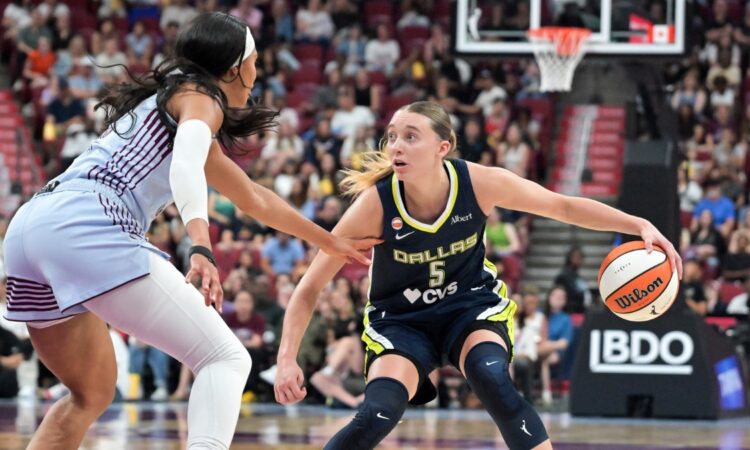 Dallas Wings guard Paige Bueckers drives with the ball as Toronto Tempo forward Isabelle Harrison defends during the first half at Bell Centre.