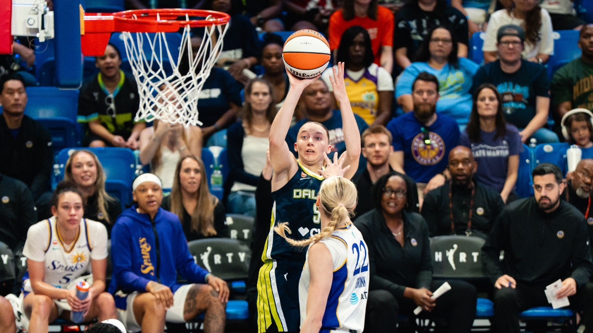 Dallas Wings guard Paige Bueckers (5) elevates for a jump shot over Los Angeles Sparks forward Cameron Brink (22) during Dallas' win over the Sparks on July 19, 2026.