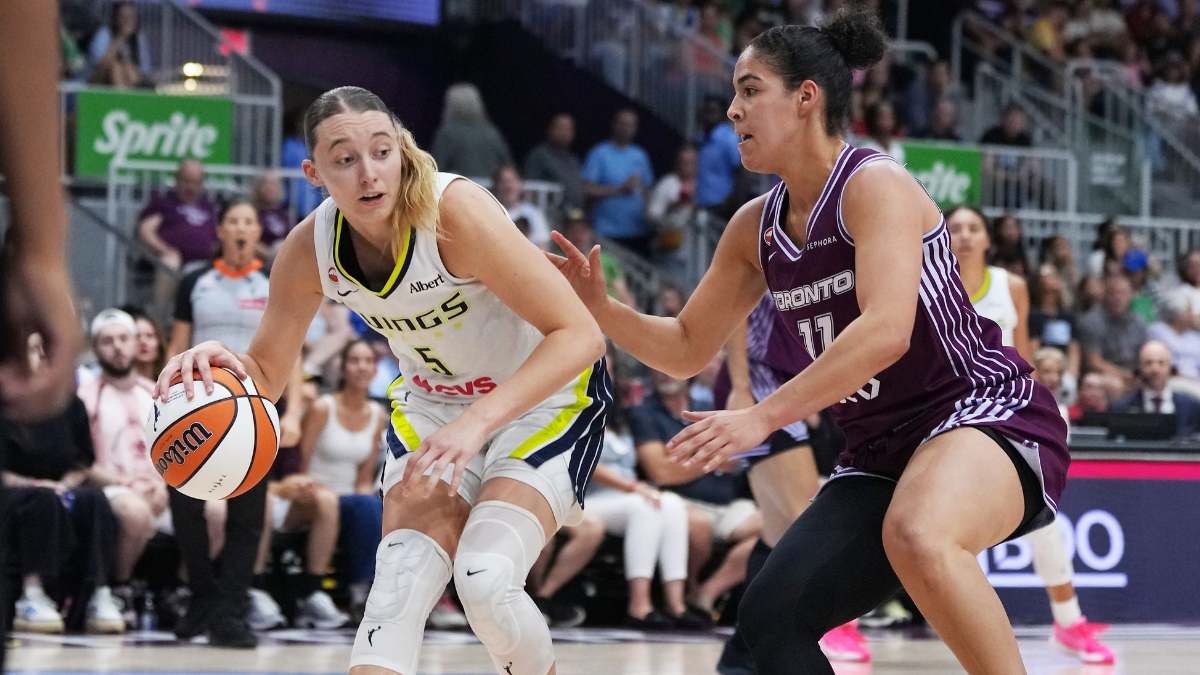 Dallas Wings guard Paige Bueckers controls the ball while Toronto Tempo guard Kia Nurse defends during the second quarter at Coca-Cola Coliseum.