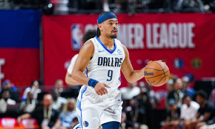 Ryan Nembhard dribbles up court for the Dallas Mavericks with Morez Johnson Jr. trailing during 2026 NBA Summer League.