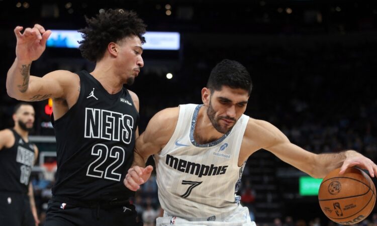 Memphis Grizzlies forward Santi Aldama drives to the basket against Brooklyn Nets forward Jalen Wilson during a game at FedExForum