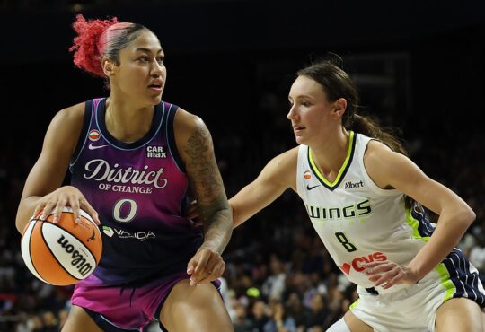 Dallas Wings forward Alanna Smith defends as Washington Mystics center Shakira Austin drives with the ball.