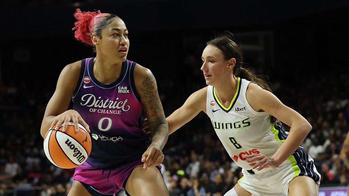 Dallas Wings forward Alanna Smith defends as Washington Mystics center Shakira Austin drives with the ball.