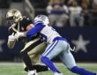 Dallas Cowboys cornerback Ameer Speed wraps up New Orleans Saints tight end Treyton Welch after a catch.