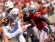 Ohio State linebacker Arvell Reese chases Texas quarterback Arch Manning as he scrambles with the ball.