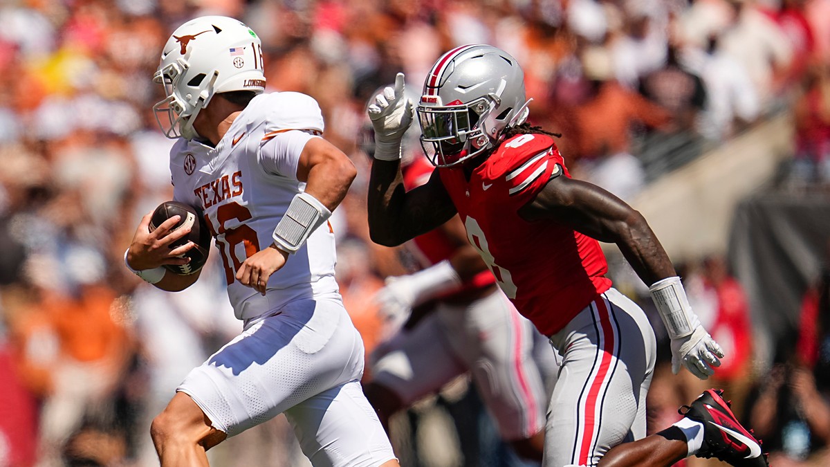 Ohio State linebacker Arvell Reese chases Texas quarterback Arch Manning as he scrambles with the ball.