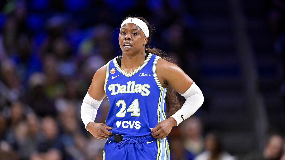 Dallas Wings guard Arike Ogunbowale stands with her hands on her hips during a stoppage against the Las Vegas Aces.