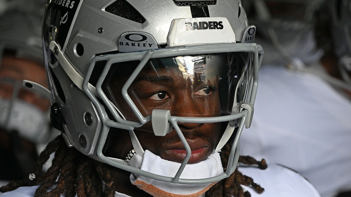 Las Vegas Raiders running back Ashton Jeanty looks out from his helmet in the tunnel at Lincoln Financial Field.