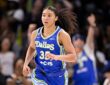 Dallas Wings guard Azzi Fudd runs up the floor in a blue No. 35 Dallas jersey.