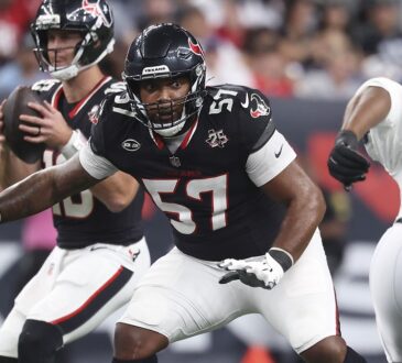 Houston Texans tackle Blake Fisher sets in pass protection with his quarterback dropping back behind him.