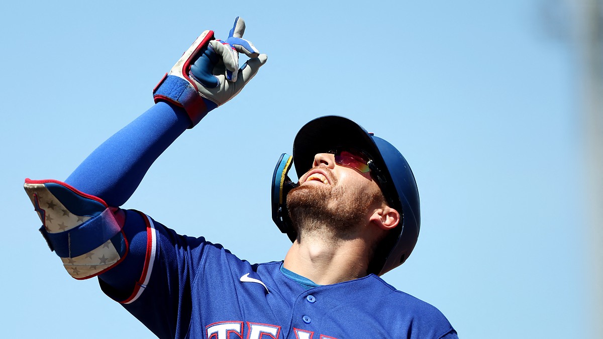 Texas Rangers right fielder Brandon Nimmo points skyward after reaching base at Sutter Health Park.