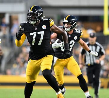 Pittsburgh Steelers offensive tackle Broderick Jones runs downfield looking for a block as tight end Robert Tonyan carries.