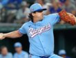 Texas Rangers pitcher Cal Quantrill winds up to deliver in a powder blue jersey at Globe Life Field.