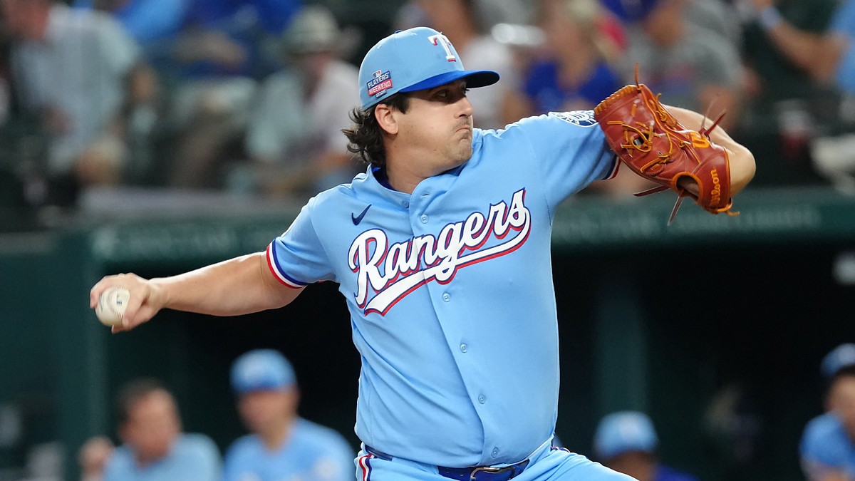 Texas Rangers pitcher Cal Quantrill winds up to deliver in a powder blue jersey at Globe Life Field.