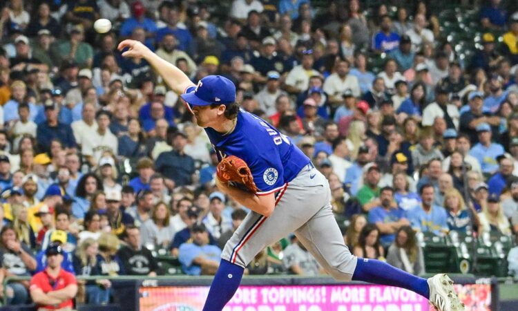 Texas Rangers starting pitcher Cal Quantrill follows through on a pitch against the Milwaukee Brewers.