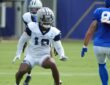 Dallas Cowboys safety Caleb Downs drops into coverage against Los Angeles Rams tight end Tyler Higbee at a joint practice.