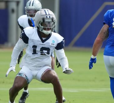 Dallas Cowboys safety Caleb Downs drops into coverage against Los Angeles Rams tight end Tyler Higbee at a joint practice.
