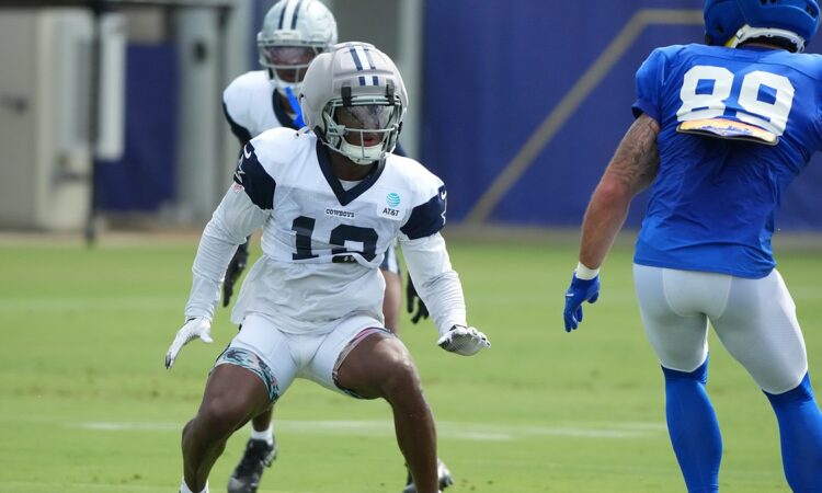 Dallas Cowboys safety Caleb Downs drops into coverage against Los Angeles Rams tight end Tyler Higbee at a joint practice.