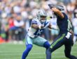 Dallas Cowboys safety Caleb Downs works to jam Seattle Seahawks wide receiver Jake Bobo at the line.