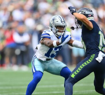 Dallas Cowboys safety Caleb Downs works to jam Seattle Seahawks wide receiver Jake Bobo at the line.