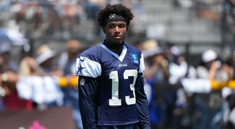 Dallas Cowboys safety Caleb Downs looks off to the side in a practice jersey during training camp.