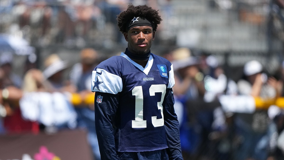 Dallas Cowboys safety Caleb Downs looks off to the side in a practice jersey during training camp.