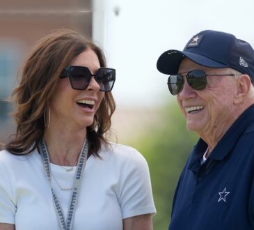 Dallas Cowboys chief brand officer Charlotte Jones laughs alongside owner Jerry Jones at training camp.