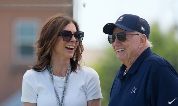 Dallas Cowboys chief brand officer Charlotte Jones laughs alongside owner Jerry Jones at training camp.