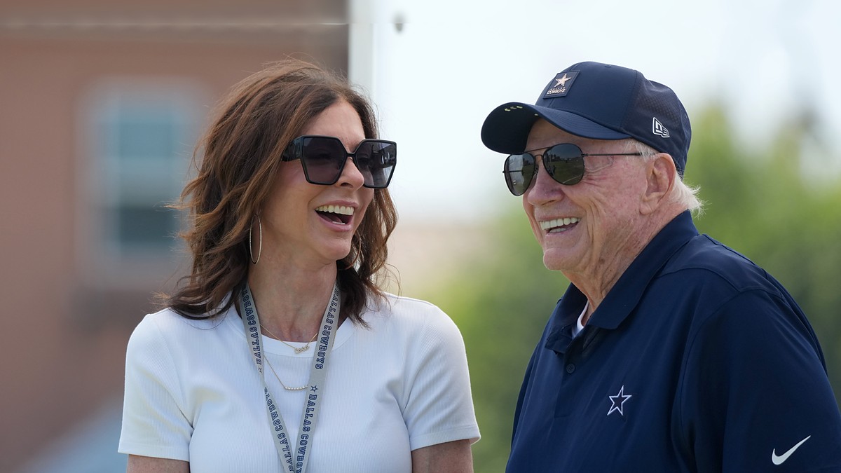 Dallas Cowboys chief brand officer Charlotte Jones laughs alongside owner Jerry Jones at training camp.