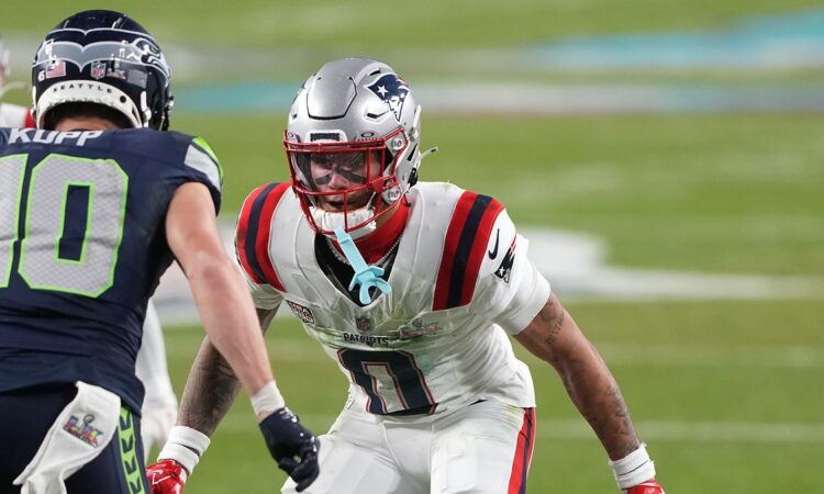 New England Patriots cornerback Christian Gonzalez shadows Seattle Seahawks wide receiver Cooper Kupp at the line.