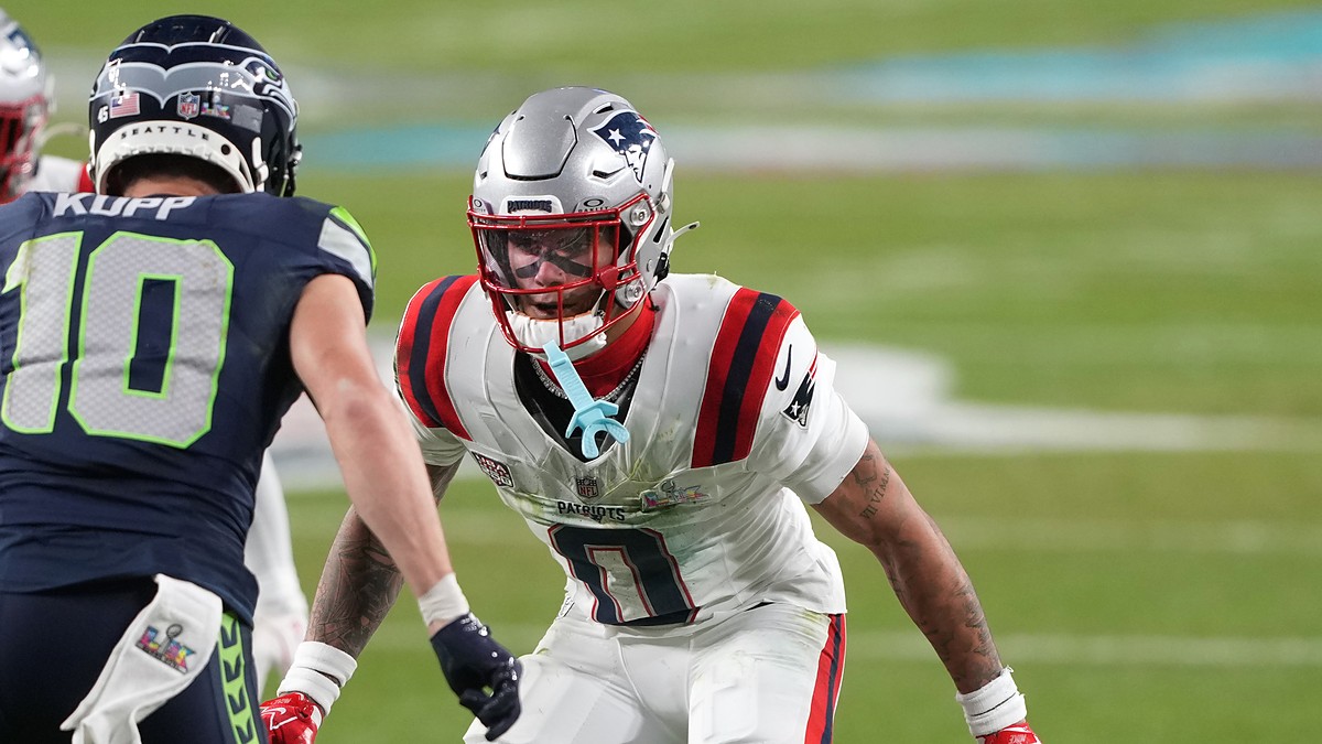 New England Patriots cornerback Christian Gonzalez shadows Seattle Seahawks wide receiver Cooper Kupp at the line.